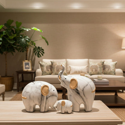 Composition éléphants céramique blanche et or mise en situation salon moderne – décoration intérieure élégante et symbolique