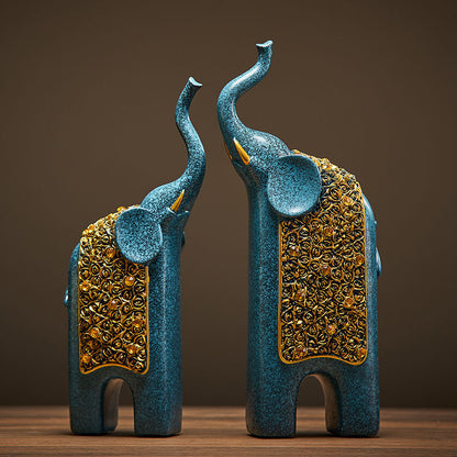 Statues éléphants bleu et or en résine posées sur une étagère, décoration intérieure douce
