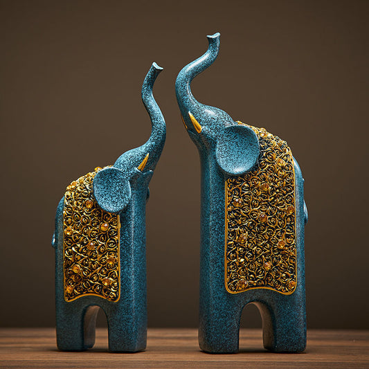 Statues éléphants bleu et or en résine posées sur une étagère, décoration intérieure douce
