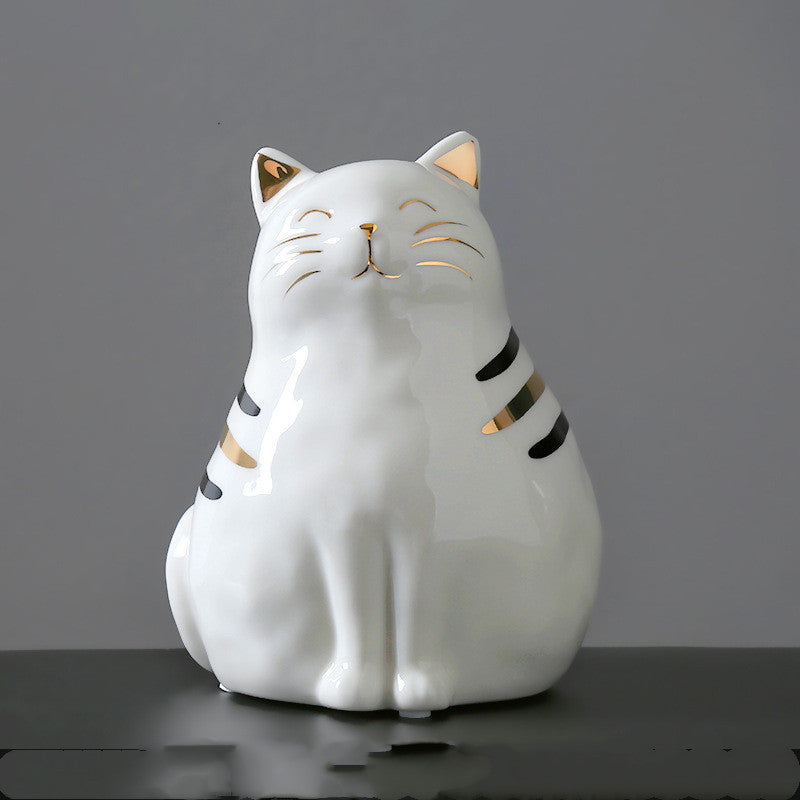 Une jolie figurine chat en céramique blanc et or, parfaite comme idée cadeau pour les amoureux des chats et de la décoration poétique