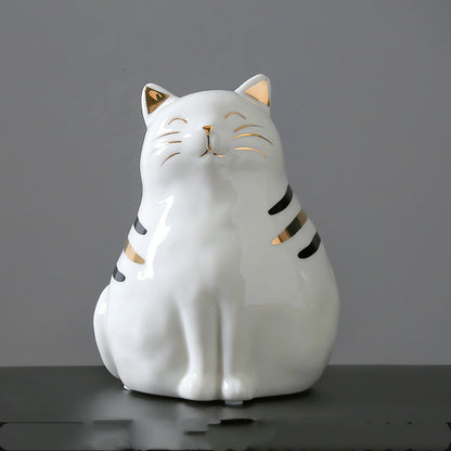 Une jolie figurine chat en céramique blanc et or, parfaite comme idée cadeau pour les amoureux des chats et de la décoration poétique